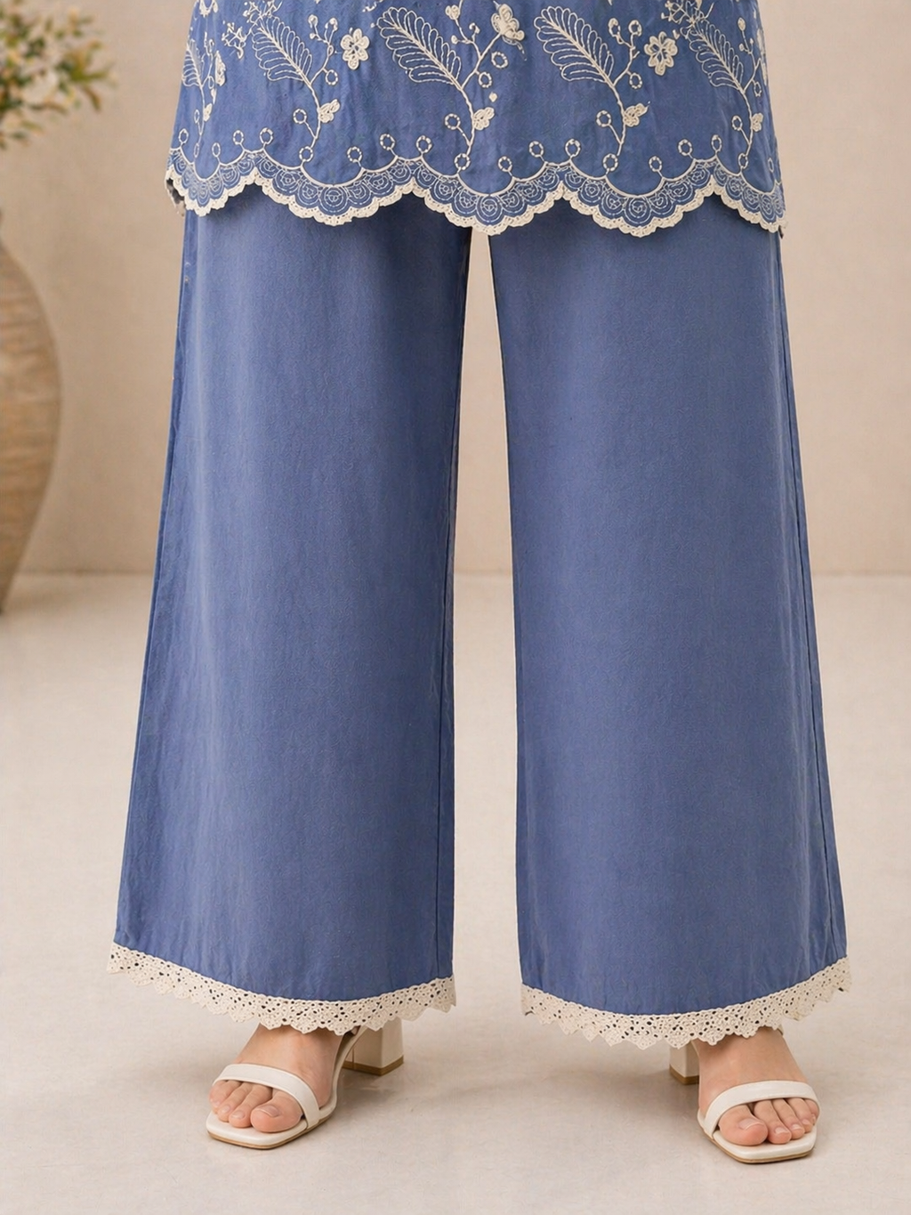 Elegant wide-leg pants featuring lace border detailing, designed for comfort and a graceful ethnic look.
