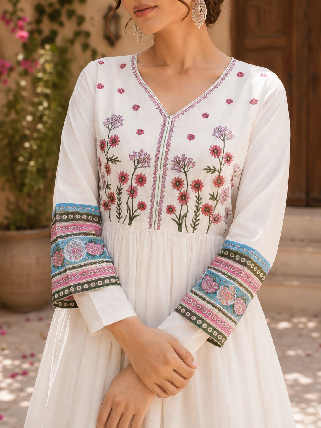 Close-up of printed border design on white cotton ethnic suit shirt